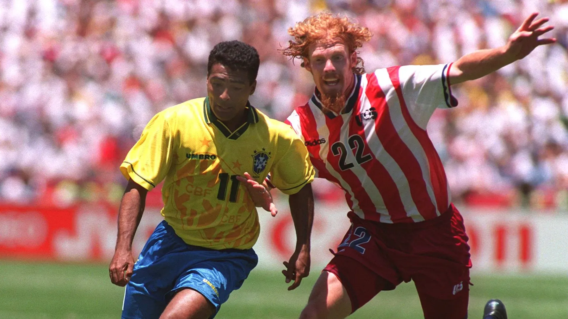 Romario of Brazil surges past Alexi Lalas of USA during the 1994 World Cup finals second round match.