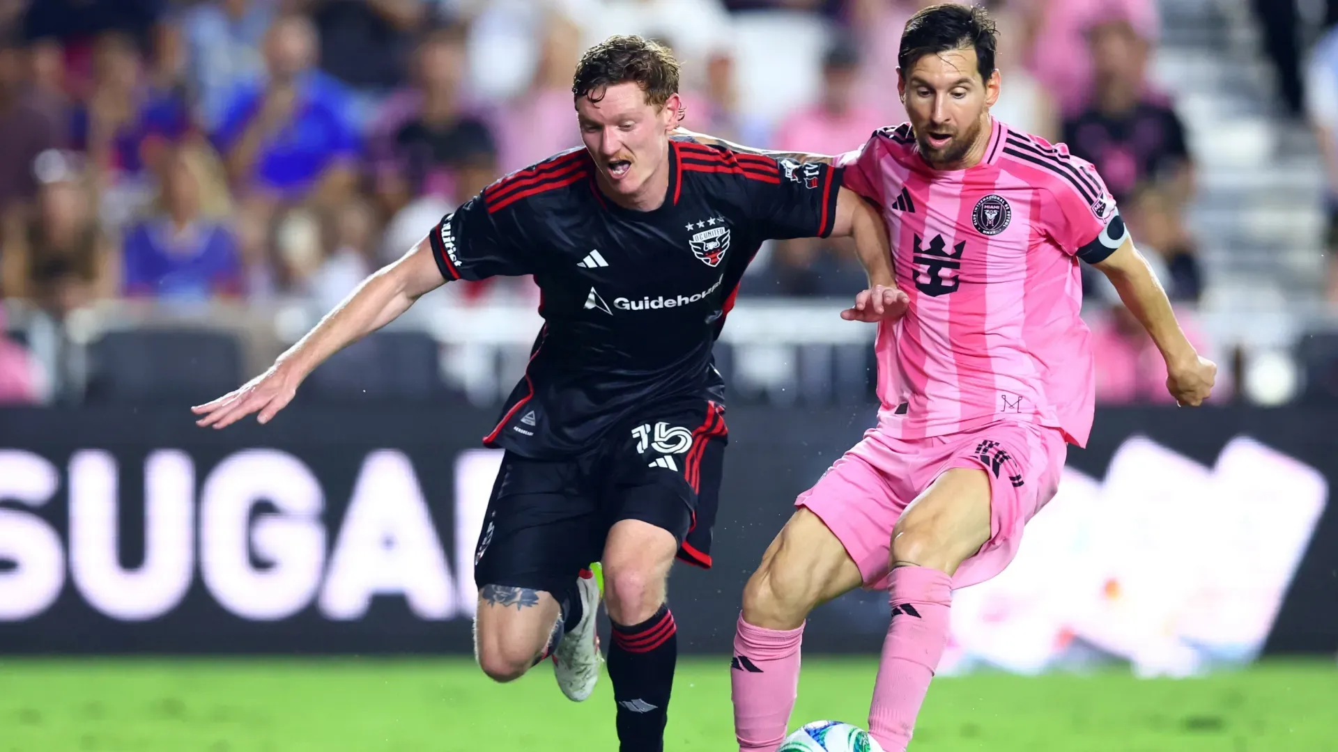 Lionel Messi #10 of Inter Miami CF is challenged by Kye Rowles #15 of D.C. United.