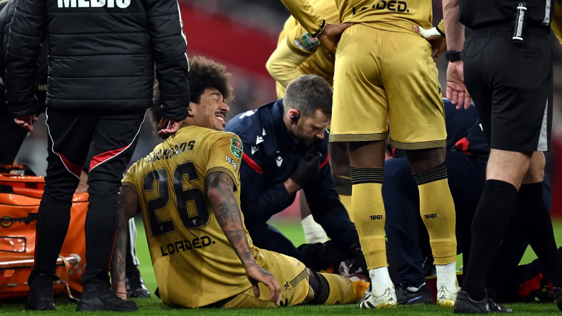 Chris Richards of Crystal Palace requires medical attention after picking up an injury against Arsenal.