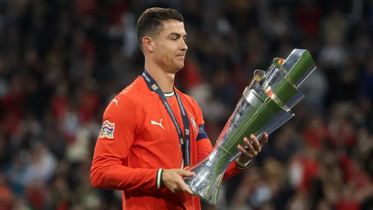 Cristiano Ronaldo holds the UEFA Nations League trophy.